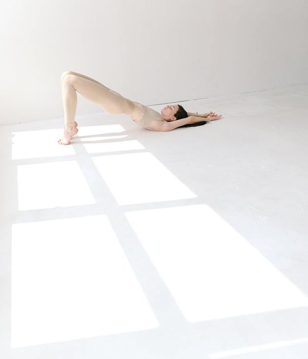 Woman in a calm yoga pose, embodying physical and mental harmony.